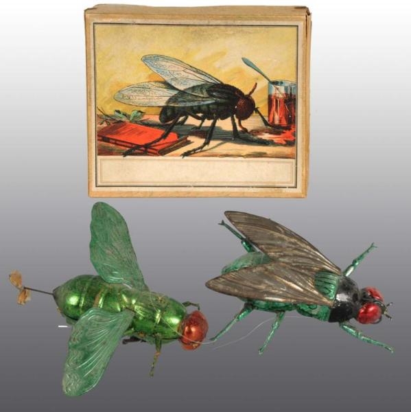 LOT OF 2: TIN FLY WIND-UP TOYS.                   