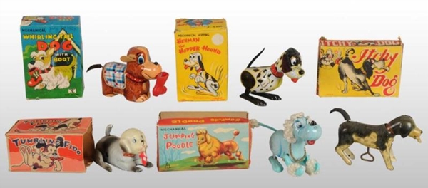 LOT OF 12: DOG WIND-UP TOYS.                      