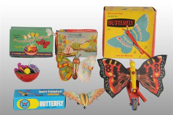 LOT OF 5: BUTTERFLY TOYS.                         