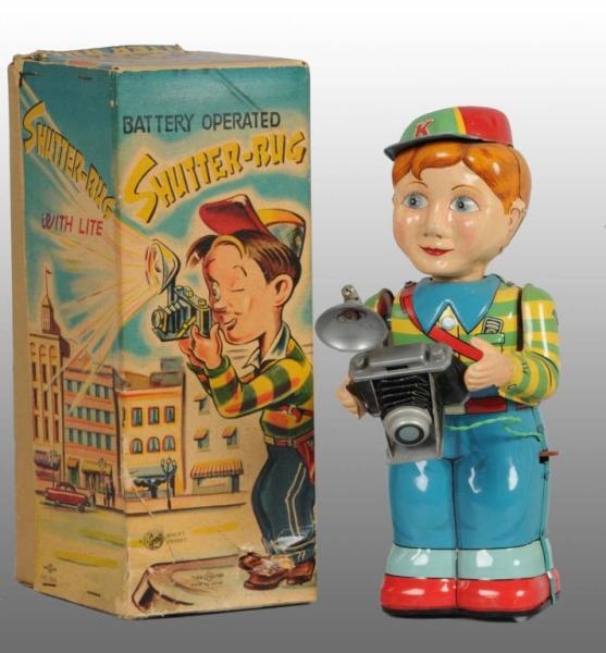 TIN SHUTTERBUG BATTERY-OPERATED TOY.              