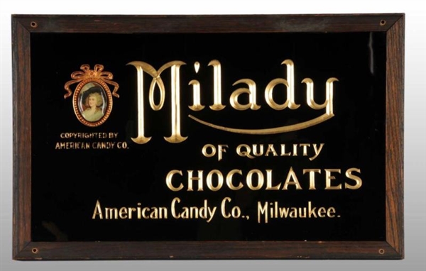 REVERSE-ON-GLASS MILADY CHOCOLATES SIGN.          