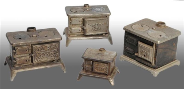 LOT OF 4: CAST IRON TOY CHILDRENS STOVES.        