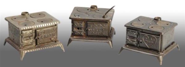 LOT OF 3: CAST IRON TOY CHILDRENS STOVES.        