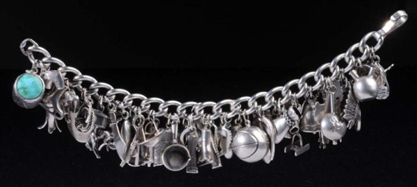 STERLING SILVER CHARM BRACELET WITH 48 CHARMS.    