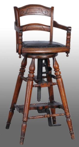 EARLY CHILDS OAK BARBER CHAIR.                   