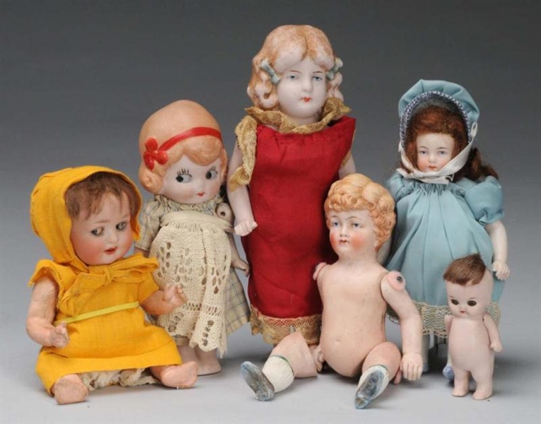 LOT OF 7: SMALL BISQUE DOLLS.                     