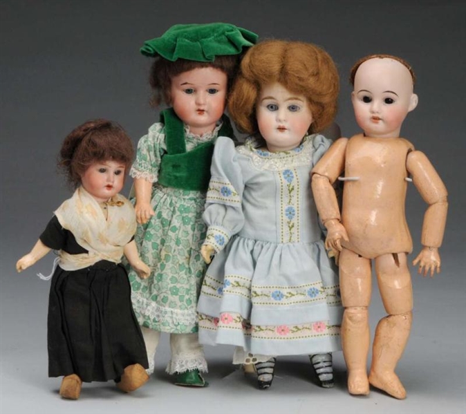 LOT OF 4: SMALL BISQUE HEAD CHILD DOLLS.          