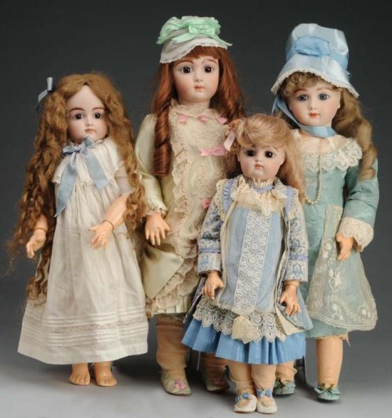 LOT OF 4: REPRODUCTION ANTIQUE DOLLS.             
