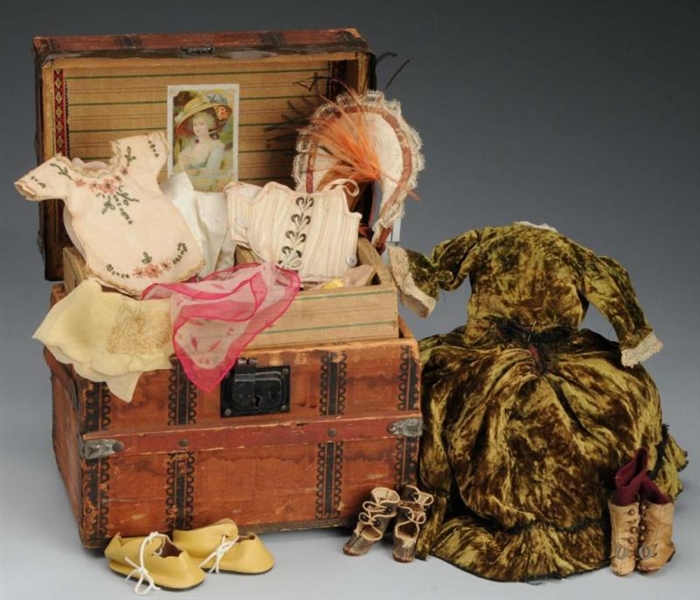 WOODEN LITHOGRAPHED TRUNK OF DOLLS CLOTHING.     