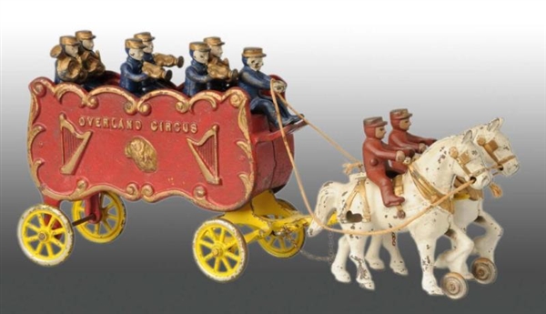 CAST IRON HORSE-DRAWN OVERLAND CIRCUS WAGON TOY.  