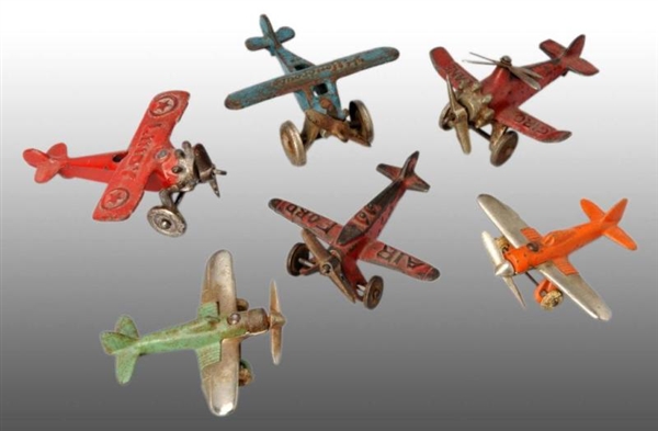 LOT OF 6: CAST IRON ARCADE & HUBLEY AIRPLANE TOYS.