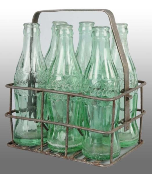 HEAVY IRON COCA-COLA 6-PACK CARRIER.              