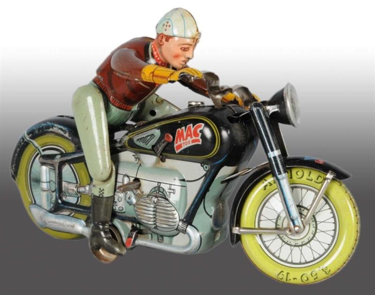 TIN ARNOLD MAC THE MOTORCYCLIST WIND-UP TOY.      