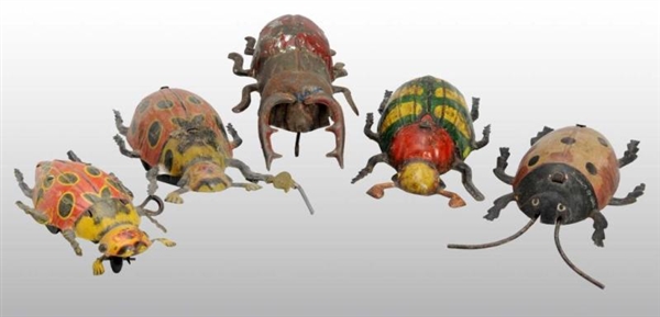 LOT OF 5: TIN BEETLE WIND-UP TOYS.                