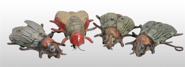 LOT OF 4: TIN FLY WIND-UP TOYS.                   