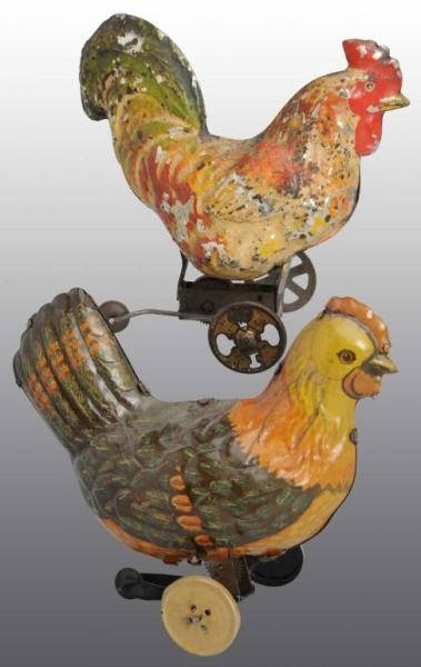 LOT OF 2: TIN ROOSTER WIND-UP TOYS.               