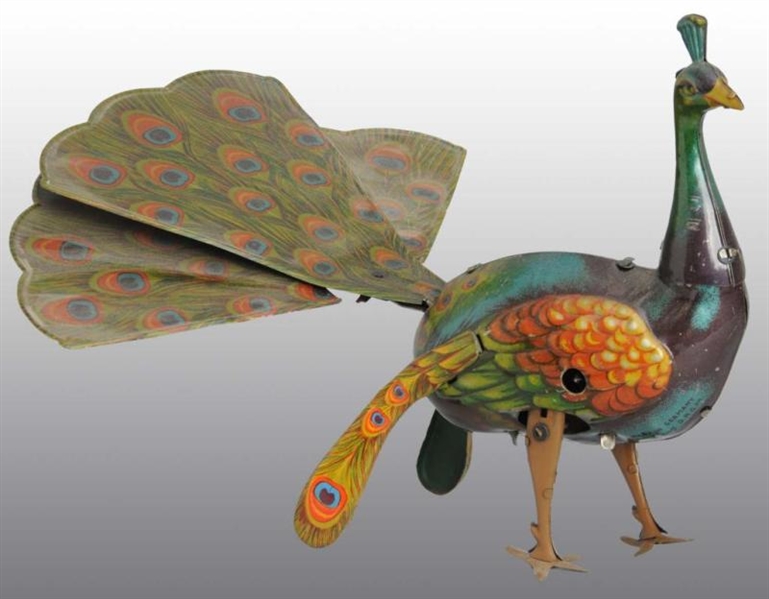 TIN LITHO PEACOCK WIND-UP TOY.                    