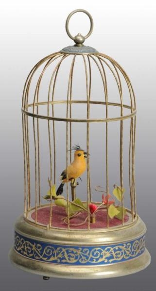BIRD IN CAGE WIND-UP TOY.                         