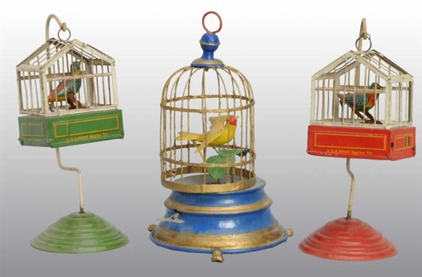 LOT OF 3: BIRD IN CAGE WIND-UP TOYS.              