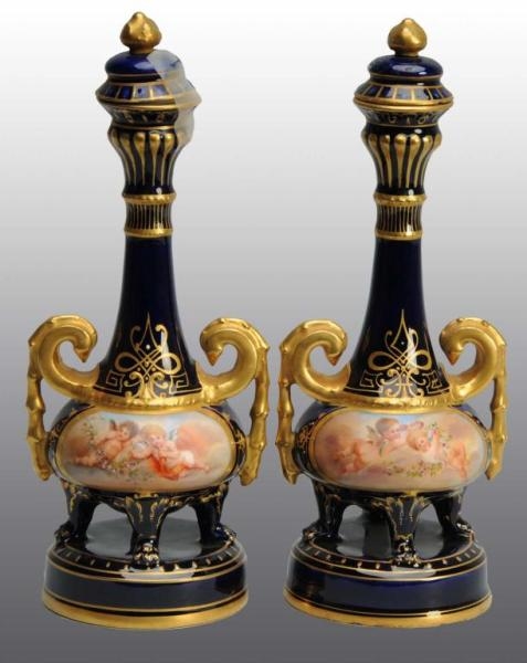 PAIR OF ROYAL VIENNA BEEHIVE BOTTLES WITH STOPPERS
