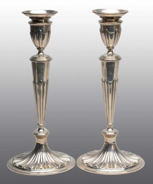 PAIR OF CONTINENTAL SILVER CANDLESTICKS.          