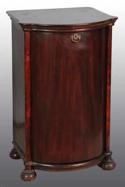 ROUND FRONT MAHOGANY CYLINDER CABINET.            