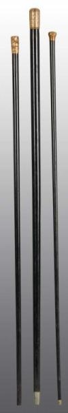 LOT OF 3: BLACK CANES WITH GOLD TOPS.             