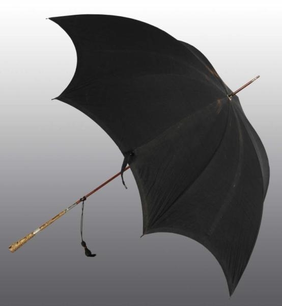 BLACK UMBRELLA WITH GOLD & PEARL INLAYED HANDLE.  