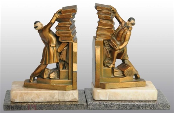 PAIR OF BRONZE BOOKENDS WITH MAN HOLDING BOOKS.   