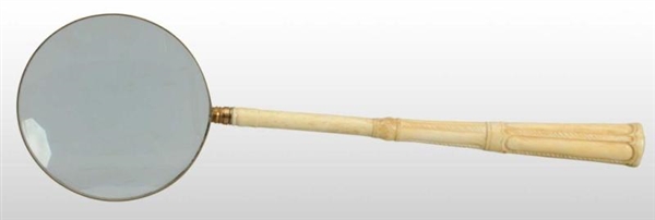 LONG-HANDLED IVORY MAGNIFYING GLASS.              