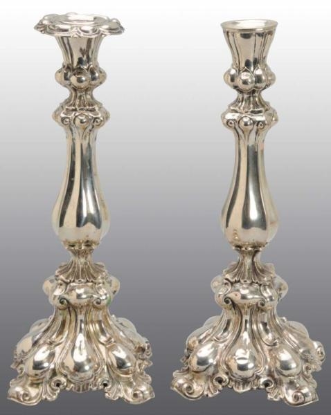 PAIR OF CONTINENTAL SILVER WEIGHTED CANDLESTICKS. 