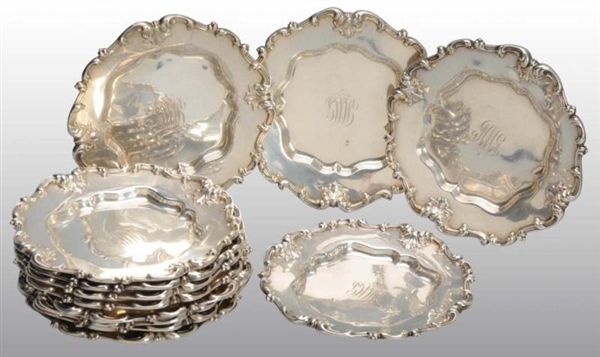 LOT OF 12: SILVER WHITING BUTTER PLATES.          