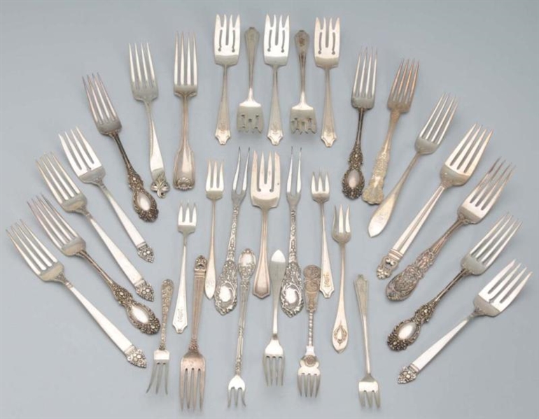 LOT OF 32: MISCELLANEOUS STERLING FORKS.          