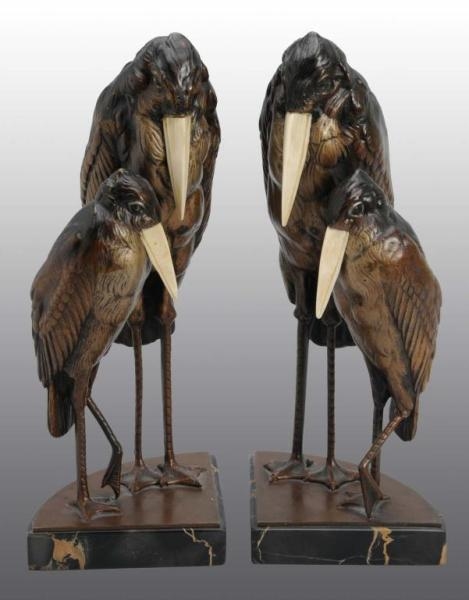 PAIR OF BRONZE & IVORY BOOKENDS.                  