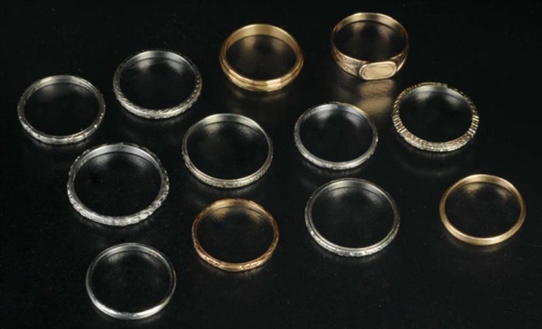 LOT OF 12: GOLD WEDDING RINGS.                    