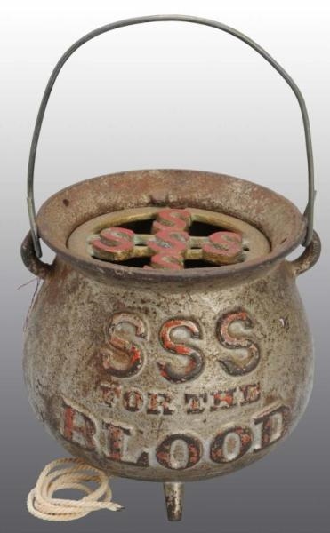 CAST IRON "SSS FOR THE BLOOD" STRING HOLDER.      