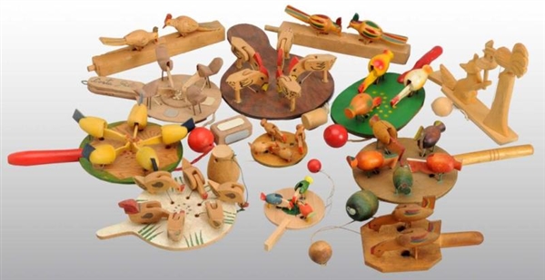 LOT OF 19: WOODEN ANIMAL PADDLE TOYS.             