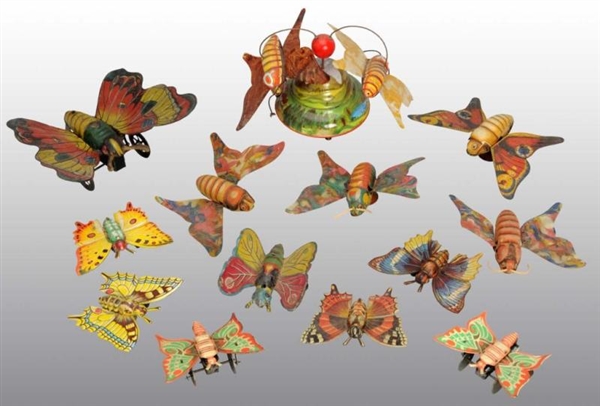 LOT OF 13: TIN BUTTERFLY TOYS.                    