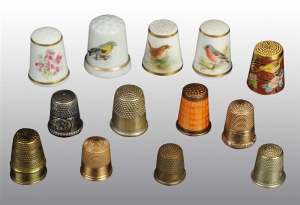 LOT OF 15: ANTIQUE SEWING THIMBLES.               