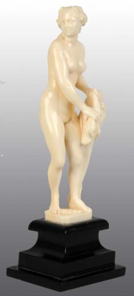 IVORY STATUE OF NUDE LADY HOLDING LIONS HEAD.    