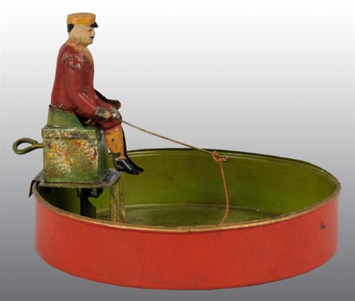 TIN HAND-PAINTED MAN FISHING TOY.                 