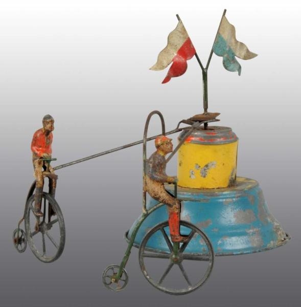 TIN HAND-PAINTED BICYCLE WIND-UP TOY.             