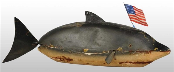 EARLY FRENCH TIN DOLPHIN TOY.                     