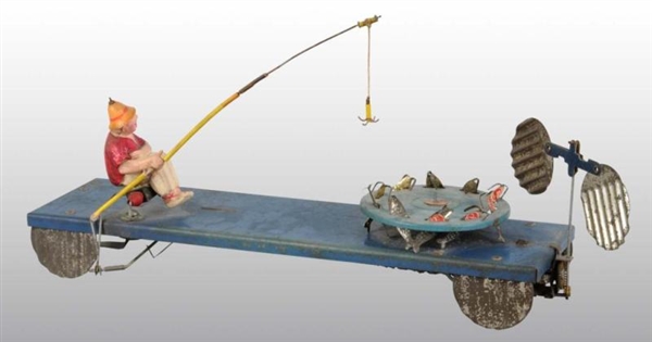 EARLY FISHING WIND-UP TOY WITH METAL BASE.        