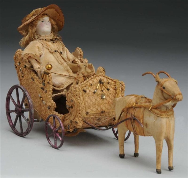 LADY IN GOAT CART TOY.                            