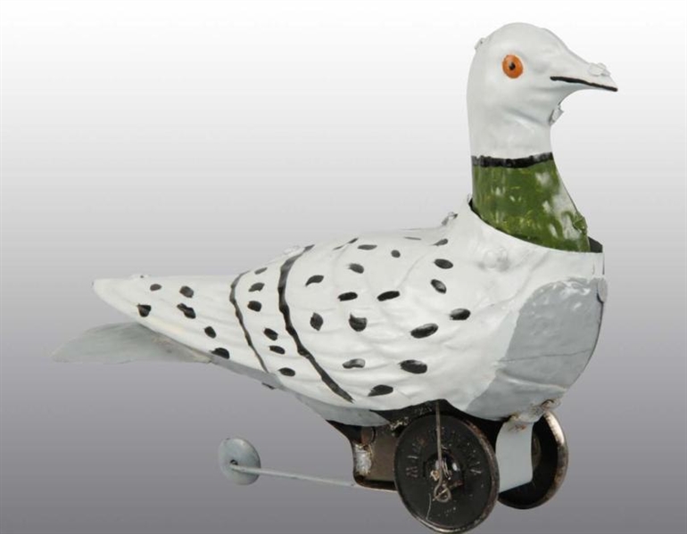TIN HAND-PAINTED PIGEON WIND-UP TOY.              