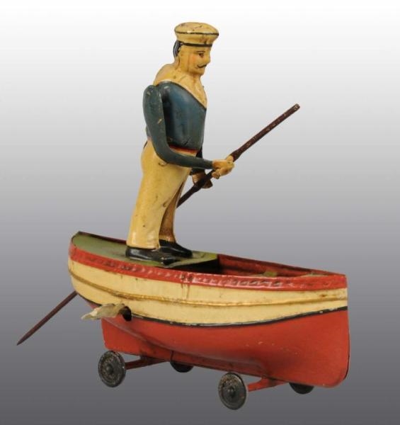 TIN HAND-PAINTED MAN ROWING BOAT WIND-UP TOY.     