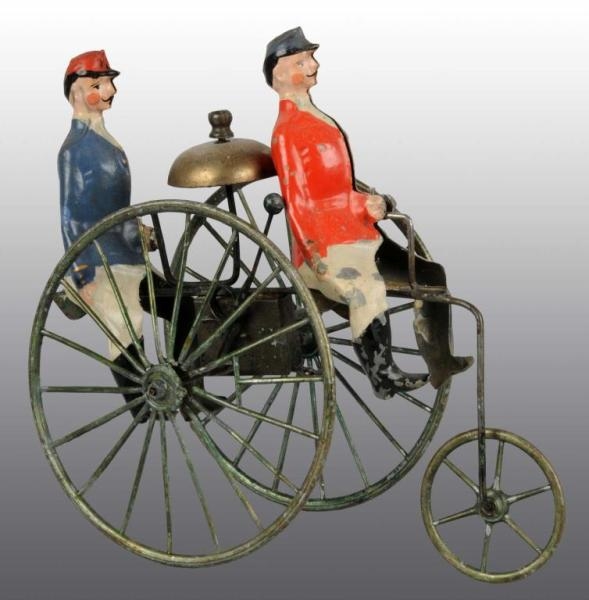 TIN HAND-PAINTED MEN ON BICYCLE WIND-UP TOY.      