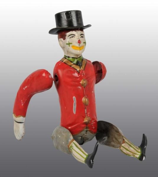 TIN HAND-PAINTED CLOWN WIND-UP TOY.               