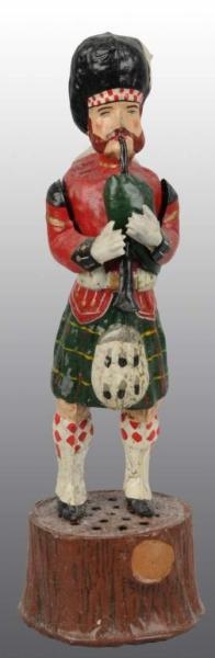 TIN HAND-PAINTED SCOTSMAN WIND-UP TOY.            